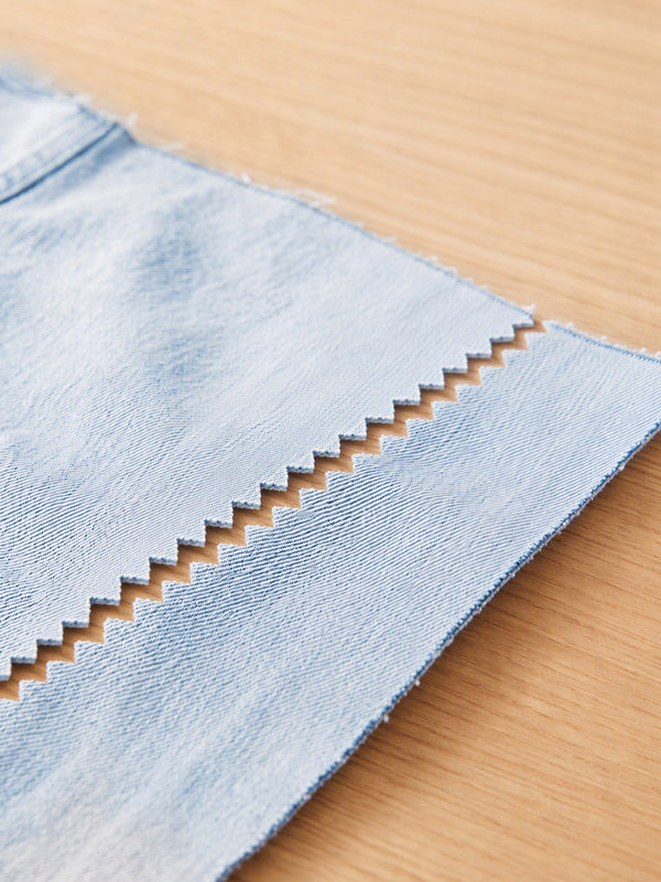 Denim with a decorative cut edge