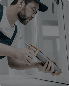 Homeowner spending time repairing a window edge